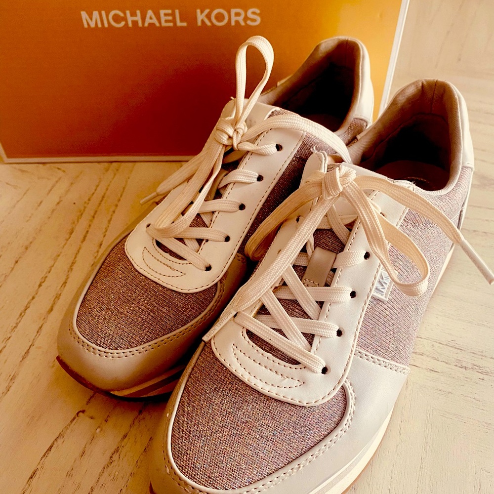 Michael Kors White and Silver partial nylon sparkle tennis shoe. Good Condition.